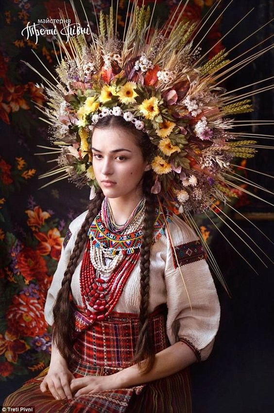 A woman models a traditional Ukrainian vinok- in this case made from flowers, leaves and b...