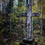cross that marks the entrance to spirit lake cemetery